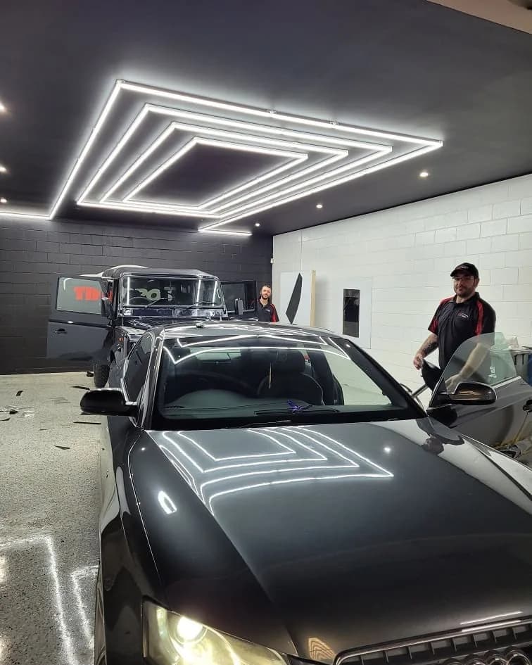 Tint Bros accredited installer team at work in the Adelaide workshop