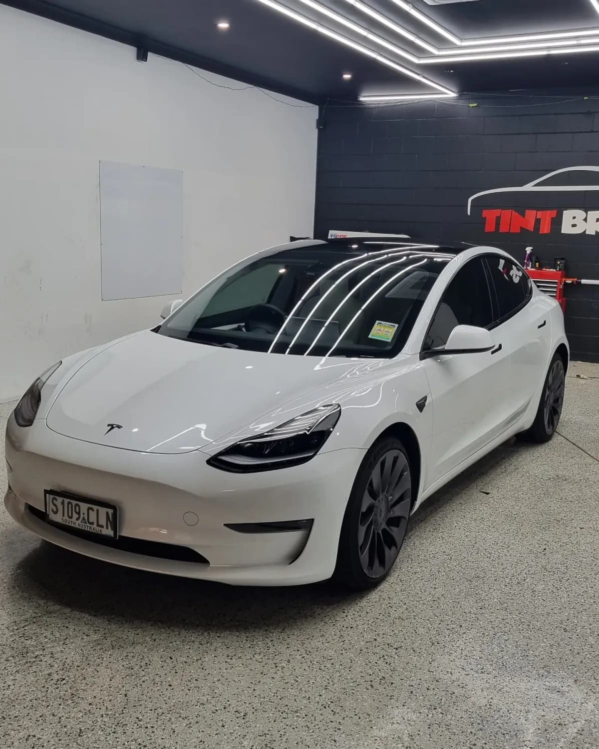 A Tesla Model 3 with ceramic window tint and coating