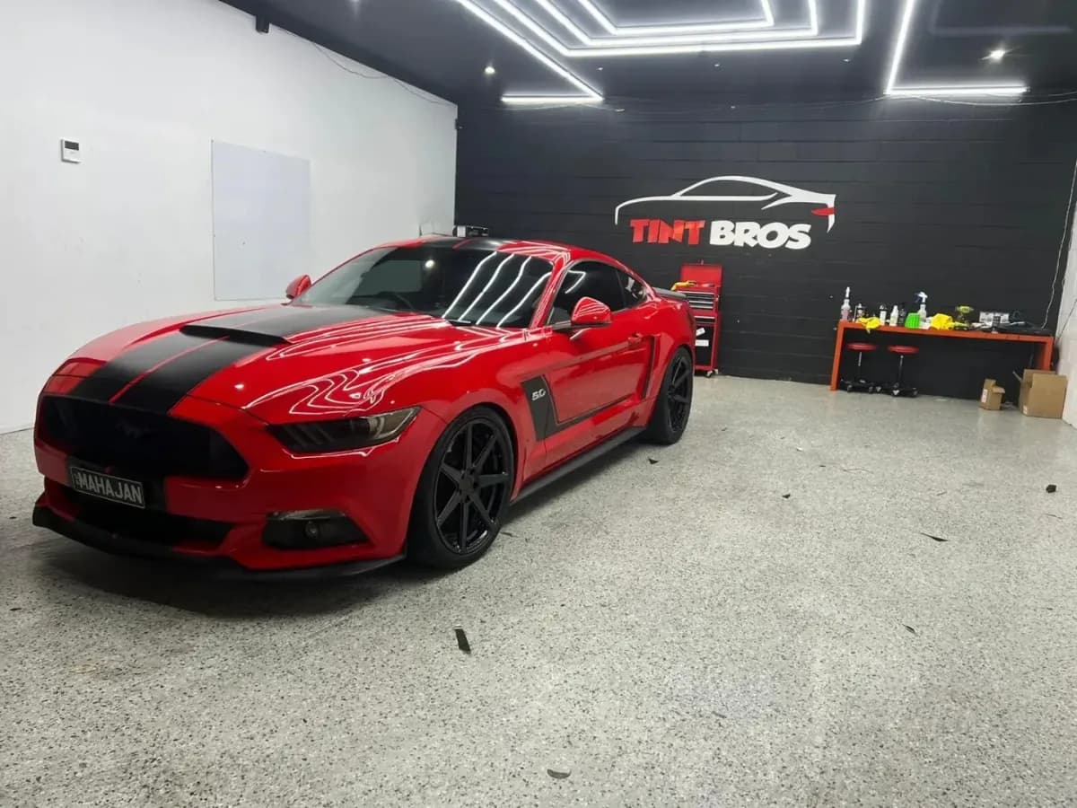 A Ford Mustang GT with window tint and ceramic coating