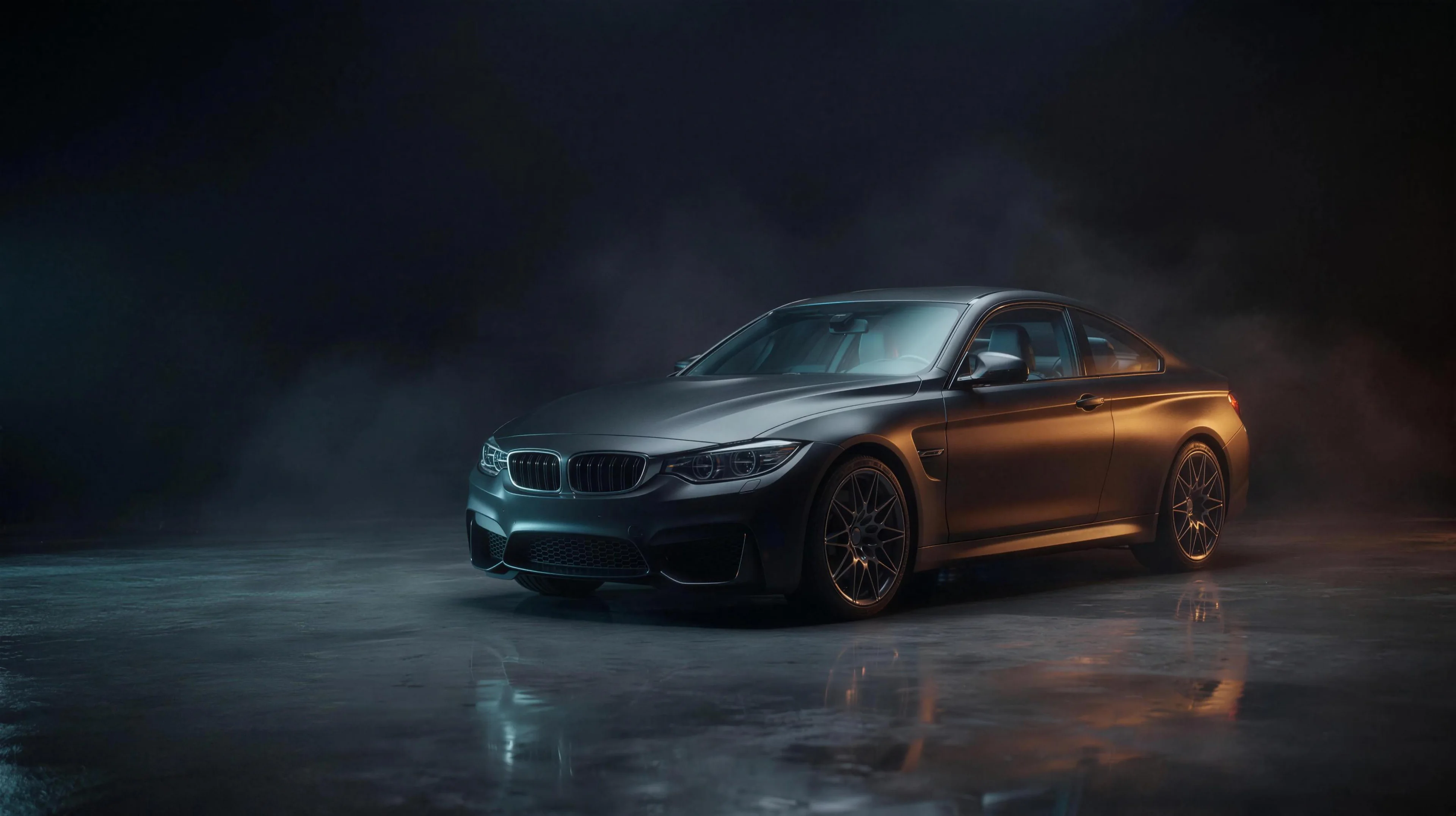 A matte coupe in the dimly lit Tint Bros detailing studio
