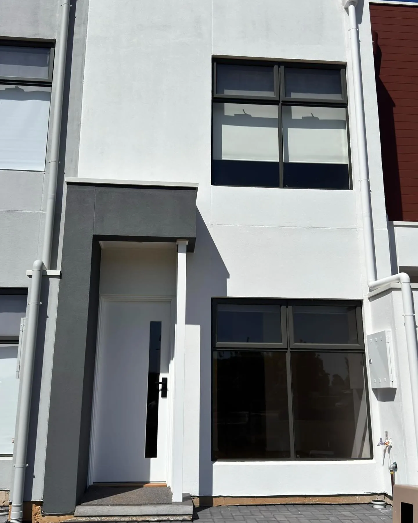 Sunlit room with tinted windows reducing glare in an Adelaide home