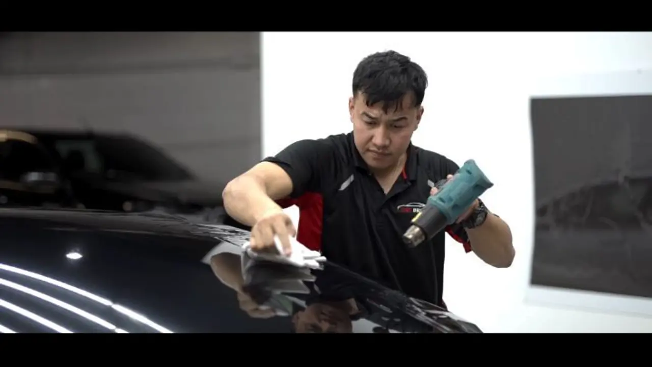 Tesla Model 3 being fitted with Rayno window tint at Tint Bros in Adelaide