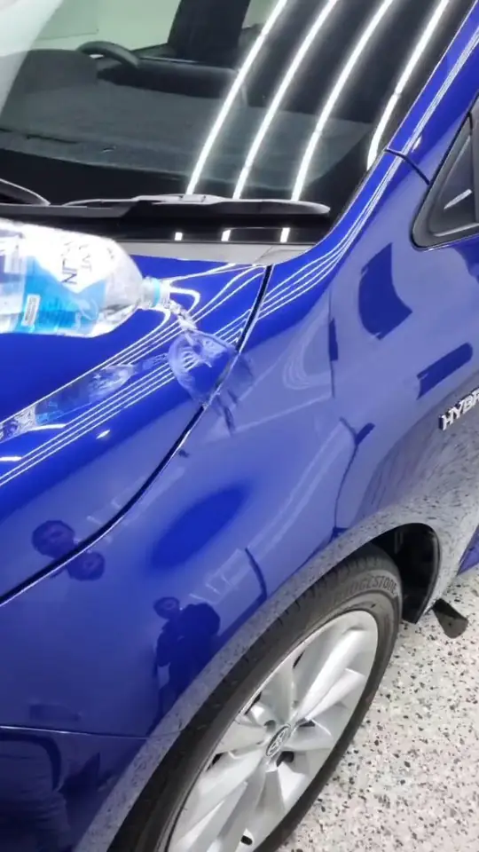 Toyota Corolla Hybrid beading water after a ceramic coating at Tint Bros
